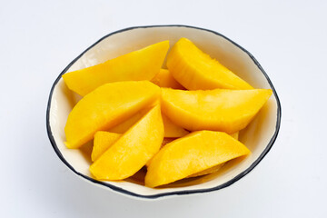 Yellow mango slices on white background.
