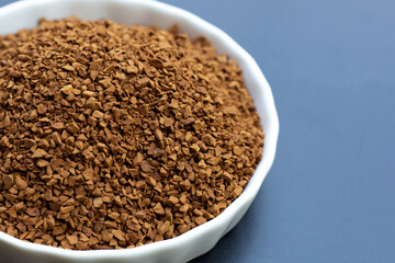 Instant coffee on dark background.