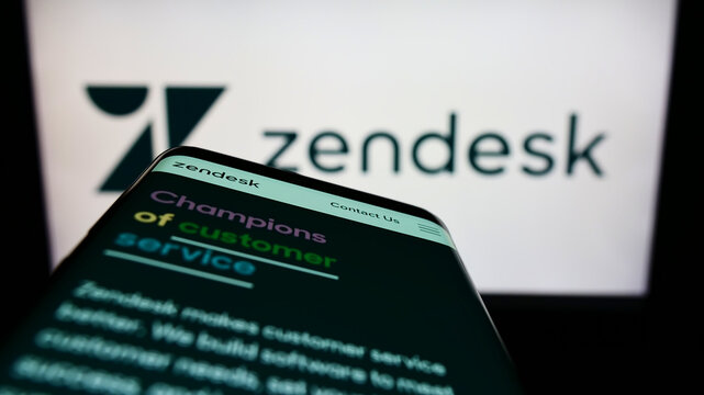 Stuttgart, Germany - 06-10-2022: Mobile phone with website of US software company Zendesk Inc. on screen in front of business logo. Focus on top-left of phone display.