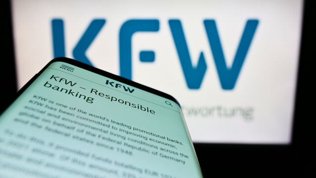 Stuttgart, Germany - 06-10-2022: Mobile phone with website of German bank Kreditanstalt fur Wiederaufbau (KfW) on screen in front of logo. Focus on top-left of phone display.
