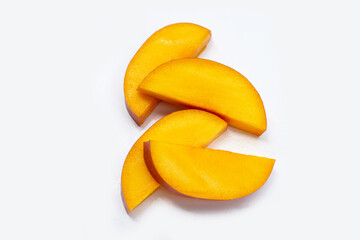 Mango fruit slices on white background.