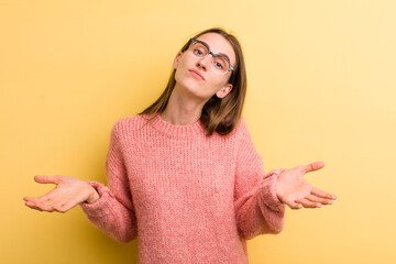 young adult pretty woman feeling puzzled and confused, unsure about the correct answer or decision,...