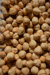 Hazelnuts, a background of baked hazelnuts, texture