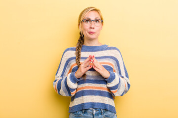young adult  blonde woman scheming and conspiring, thinking devious tricks and cheats, cunning and...