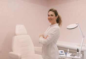 Portrait of young professional podiatrist in her podiatry clinic. Healthcare. Woman body care. Spa...