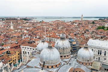 Fototapeta na wymiar View of the domes of the St Mark's Basilica in Venice from the St Mark's Campanile