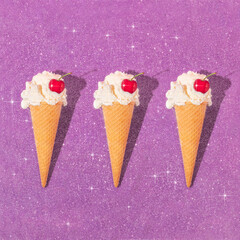 Summer creative pattern with ice cream cones and cherries on purple sparkle background.  70s, 80s...