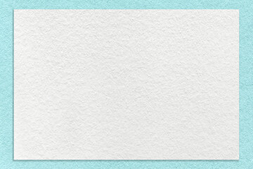 Texture of craft white color paper background with light blue border, macro. Structure of vintage...