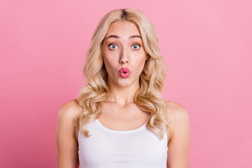 Portrait of attractive stunned girly blond girl sudden news reaction pout lips isolated over pink...