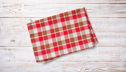 Obraz premium Folded towel, linen tablecloth on wooden desk top view.
