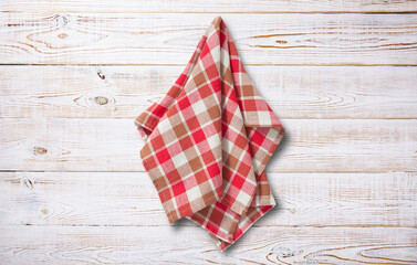 Napkin or dish towels with folds on wooden desk. Front view