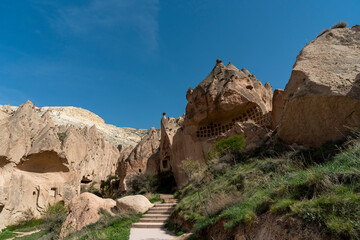 Fototapeta premium Selective focus on ancient cave underground city and Zelve open air museum in Cappadocia, Turkey.