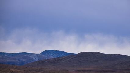 Fototapeta na wymiar Desert Mountains under a cloudy sky