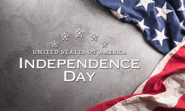 Happy Independence day concept made from American flag on dark stone background.