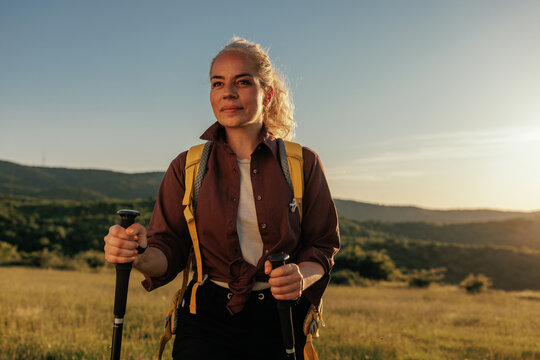 Female hiker relaxing after walk