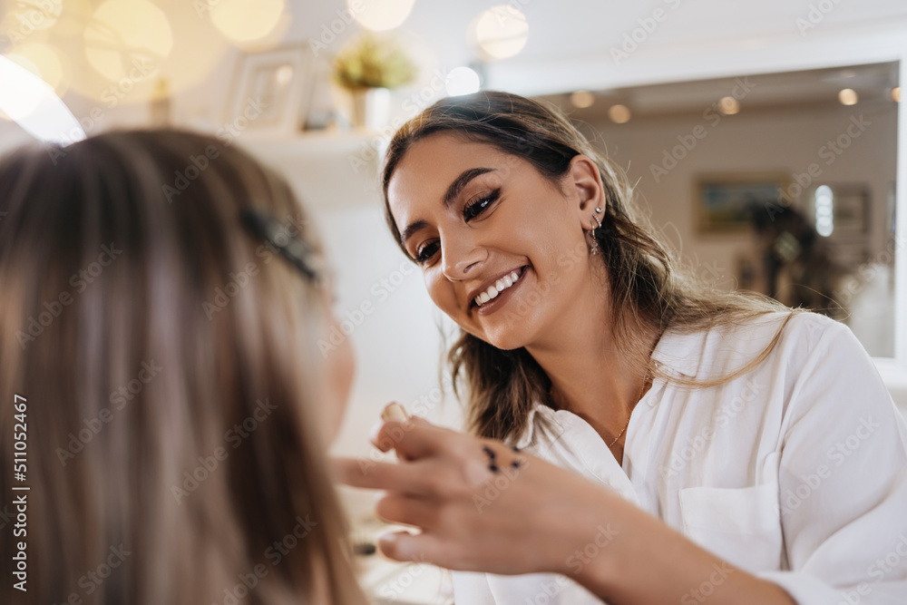 Canvas Prints makeup process. professional artist applying make up on model face. focus on beautician face. bright