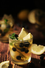 Cold ice tea with lemon and berries