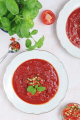 Plates with traditional gazpacho tomato soup	