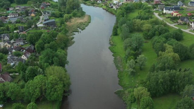drone footage of Sesupe river beside Marijampole slowly flowing