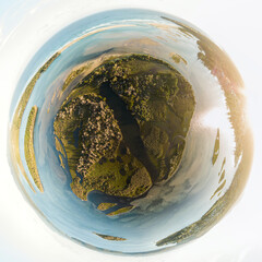 Aerial view over islands in the Mallacoota Inlet near the mouth of the Wallagaraugh River at sunset, eastern Victoria, Australia, December 2020.