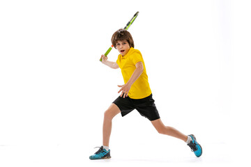 Dynamic portrait of teen, sportive kid playing tennis isolated over white studio background. Concept of sport, achievements, hobby, skills - obrazy, fototapety, plakaty