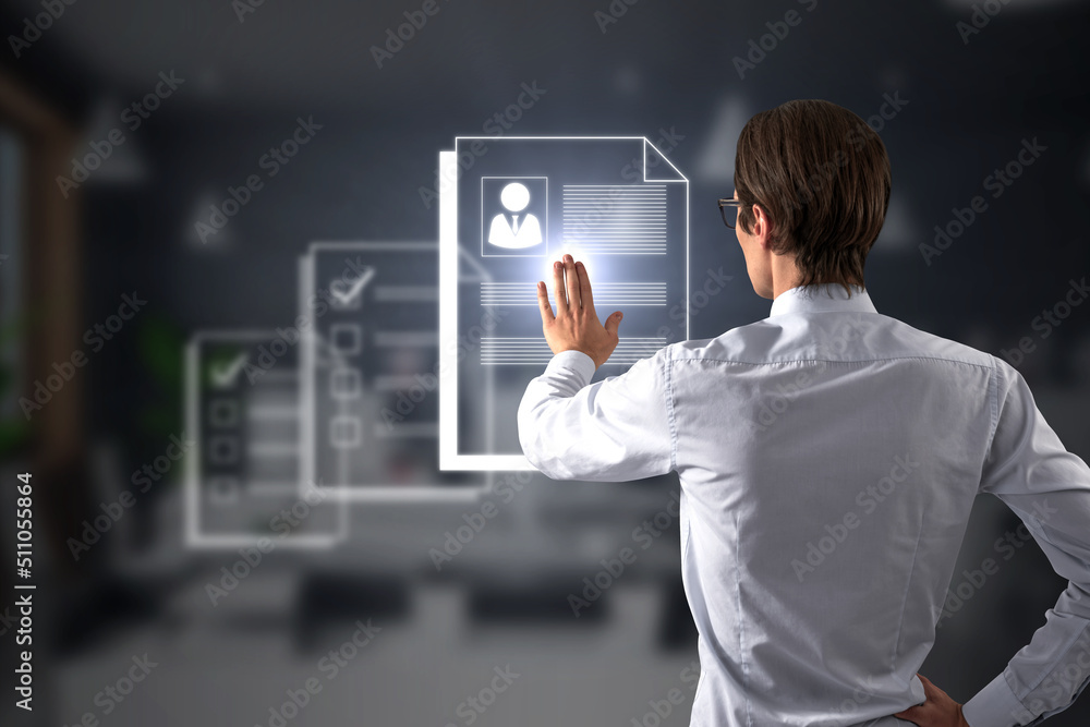 Poster HR and recruiting concept with manager back view goes through different digital resume on virtual screen to choose the perfect one