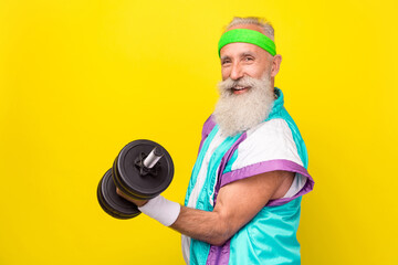 Profile photo of sportive cheerful person arm hold lift dumbbell motivation effort isolated on yellow color background