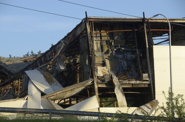 War in Ukraine. Destroyed buildings in Kyiv region after russian army attack. Consequences of russian invasion in Ukraine. 