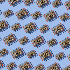 Seamless pattern of shopping baskets big and small with quail eggs on blue background. Top view. Website background.