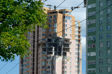 War in Ukraine. Destroyed building in Kyiv after russian missile attack. Consequences of russian invasion in Ukraine. 