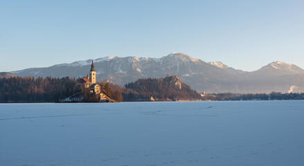 Winter morning at frozen lake Bled