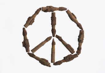 No war conceptual image. The symbol of peace in the old cartridge. Old rifle bullet found in the...