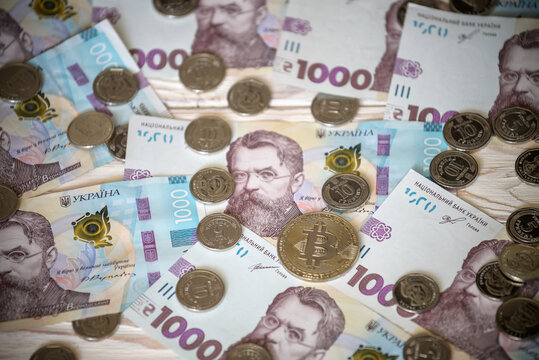 Bitcoin over the ukrainian hryvnia currency. Close up