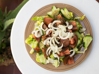 vegetarian healthy vegetable salad on brown plate