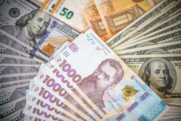 Dollar banknotes of the USA. Amerikan dollars. Money of USA and Ukrainian hryvnia. 1000 Ukrainian hryvnia