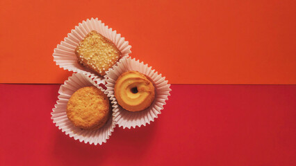 shapes of cookies in stack on red background