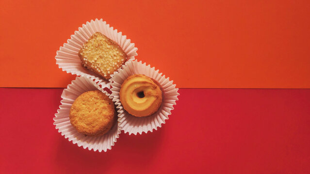 shapes of cookies in stack on red background
