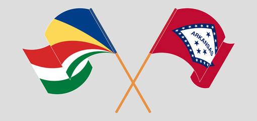 Crossed and waving flags of Seychelles and The State of Arkansas