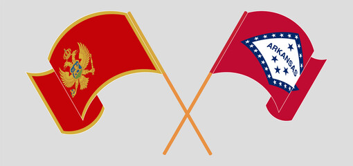Crossed and waving flags of Montenegro and The State of Arkansas