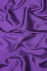 Rich and luxury red silk fabric texture background.