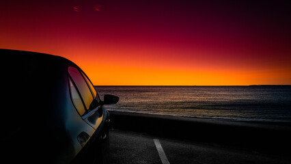 Seascape at sunrise on Cape Cod beach parking lot in Falmouth, Massachusetts. Travel road trip landscape at dawn.