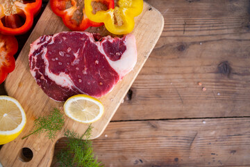 camping cook concept, Cooking Angus steak with onion and rosemary on  iron pan in camping outdoor.