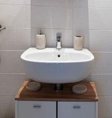 Stylish vessel sink on light countertop in modern bathroom