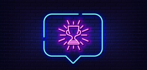Neon light speech bubble. Award cup line icon. Winner Trophy symbol. Sports achievement sign. Neon light background. Trophy glow line. Brick wall banner. Vector