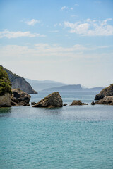 Beautiful summer Mediterranean coast with large sea stones