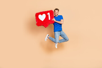 Full size portrait of excited energetic person hold big like collage isolated on beige color...