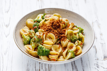orequette pasta with broccoli on a white background