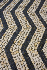 Traditional pattern cobblestone pavement (calçada portuguesa) in  Portugal