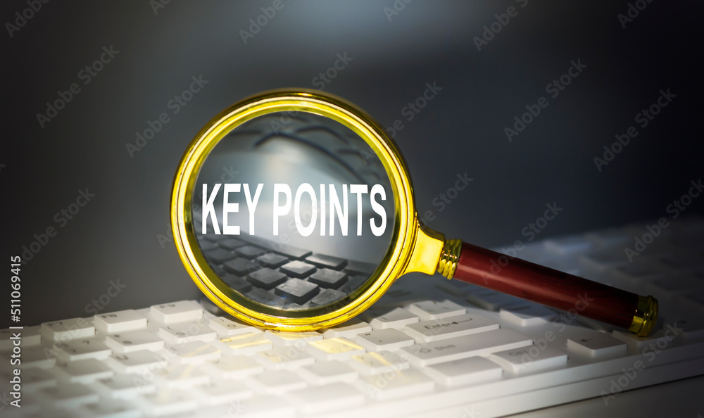 Poster key points word concept on a magnifier on the keyboard