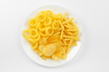Assortment of snacks for beer on a white plate.